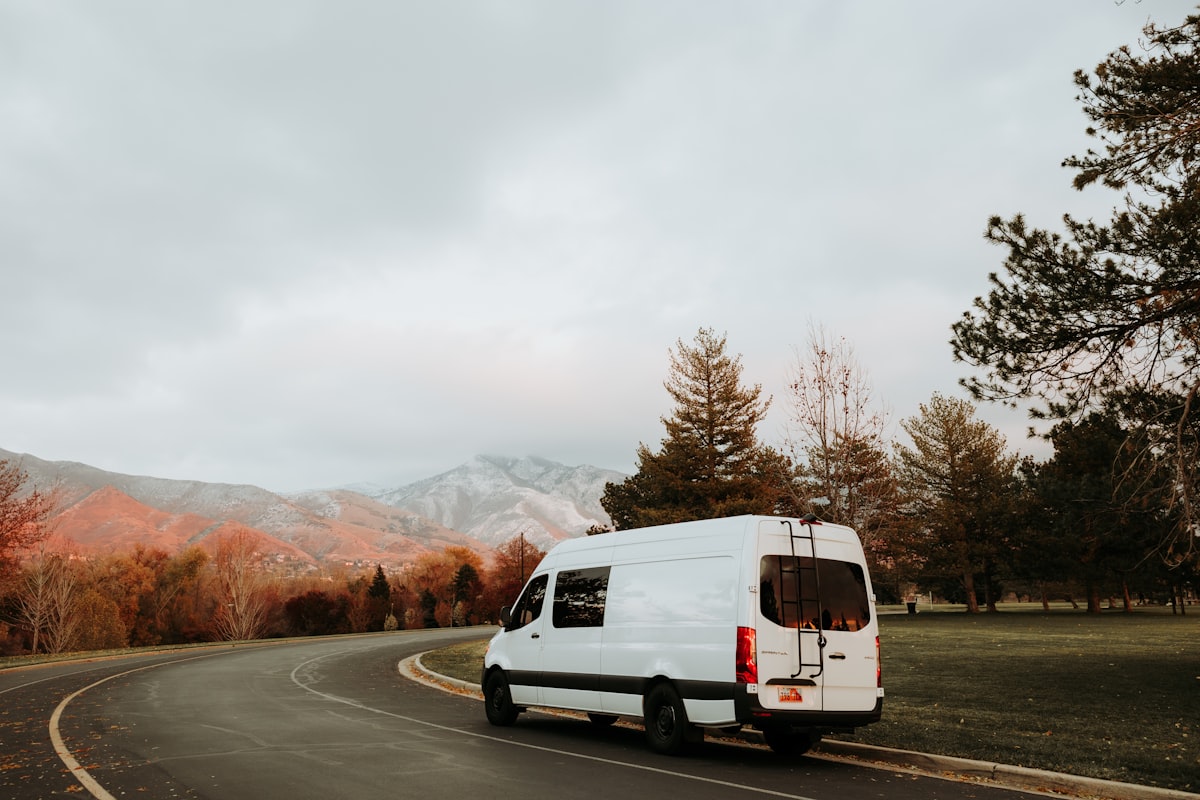 Mercedes-Benz Sprinter passenger van on a quiet road, ready for a group trip