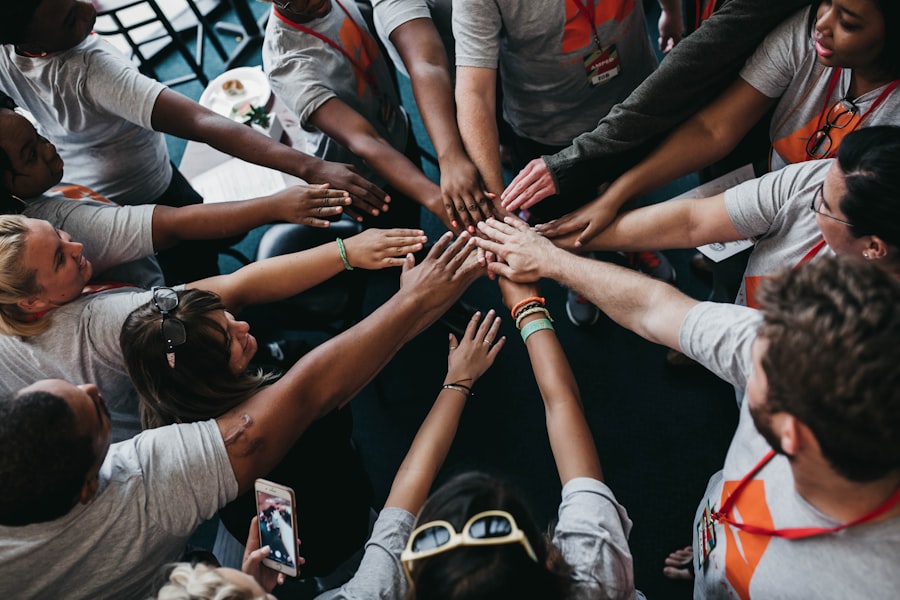 Colleagues joining hands together in a circle