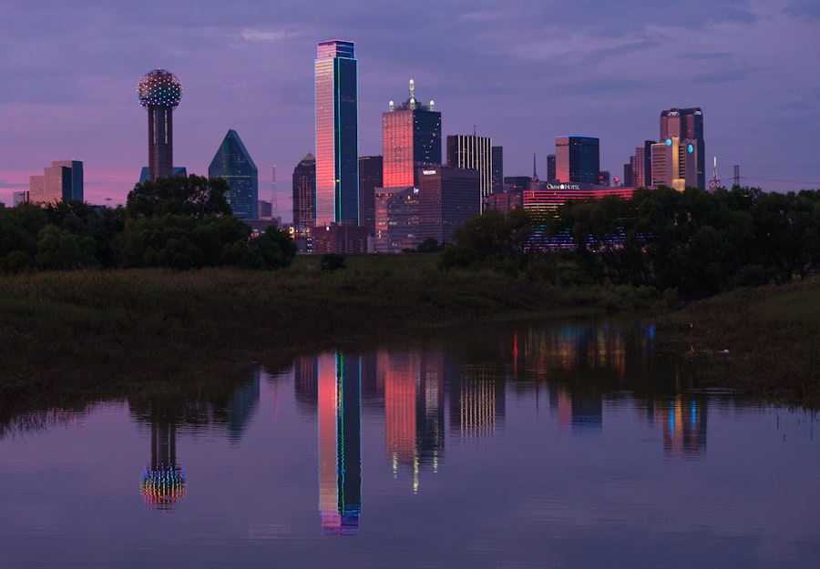 The Dallas skyline reflected in still water at dusk